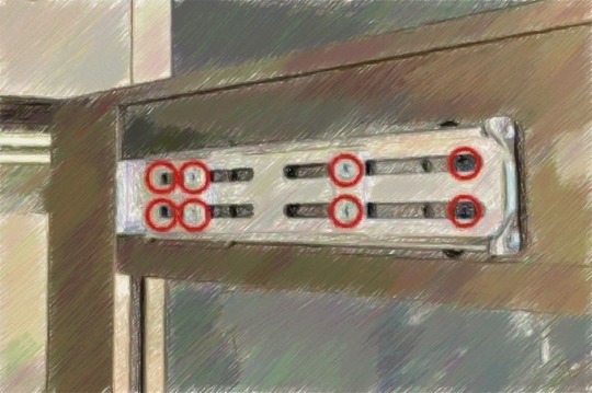 ドアクローザー交換手順7、固定プレートに付いているネジを外す。